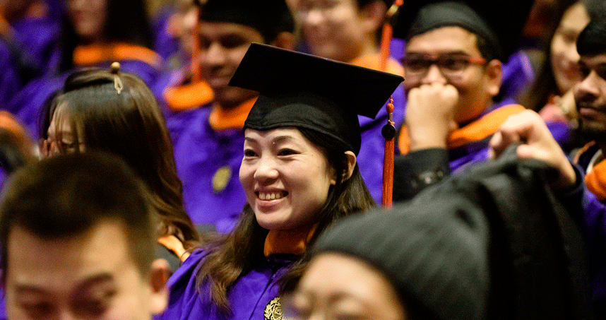 A graduate listens to the address by Matthew Terrell ('73) on December 15. Credit: Joel Wintermantle