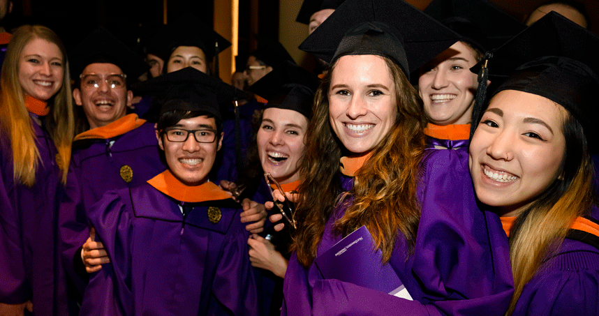 A group of graduates pose following the commencement ceremony. Credit: Joel Wintermantle