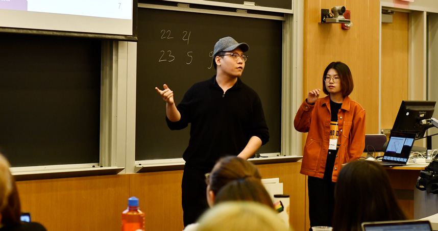 Yanrong Ji (left) and Sharon Zhang make their final presentation to judges.