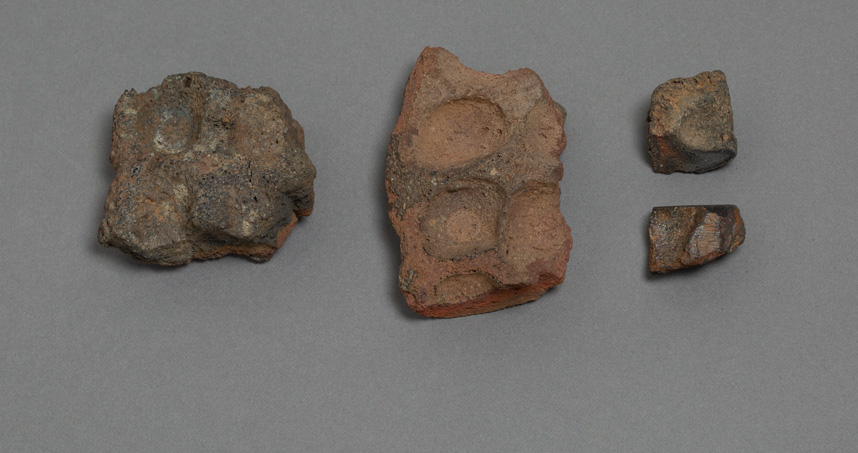 Coin mold fragments.Photograph by Clare Britt, courtesy of The Block Museum of Art.