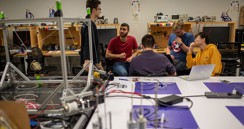 Students worked in two groups to use robotics to address research challenges. Credit: Rob Hart