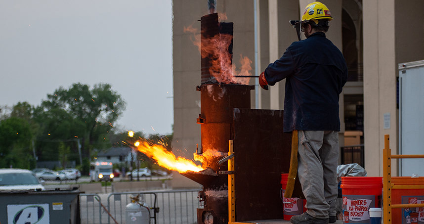 A group of Northwestern students prepare for the Design 395-64 class' annual iron pour. Credit: Rob Hart