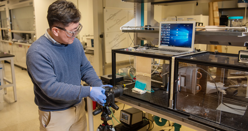 Ken Park works in his lab to visualize condensation frosting, a component of his atmospheric water research.