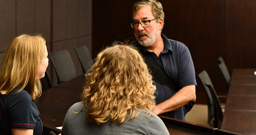 Larry Birnbaum, professor of computer science, discusses the law and technology initiative with peers.