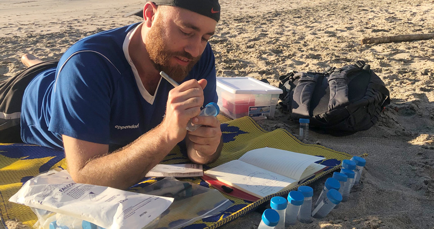 PhD candidate Matthew Verosloff samples water in Costa Rica to test the new system.