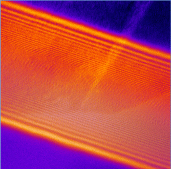 Seeing the invisible: An electron hologram of a grain boundary in a lightly doped solid electrolyte sample from which electric potential at the grain boundary can be recovered.