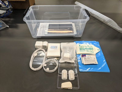 Devices are packed into kits for hospitals and patients with cases, tablets, cords and instructions. Credit: Northwestern University