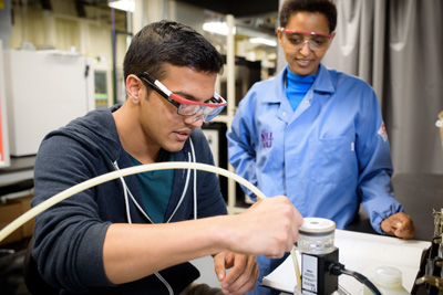 Sossina Haile works with a student in her lab before the COVID-19 pandemic. 