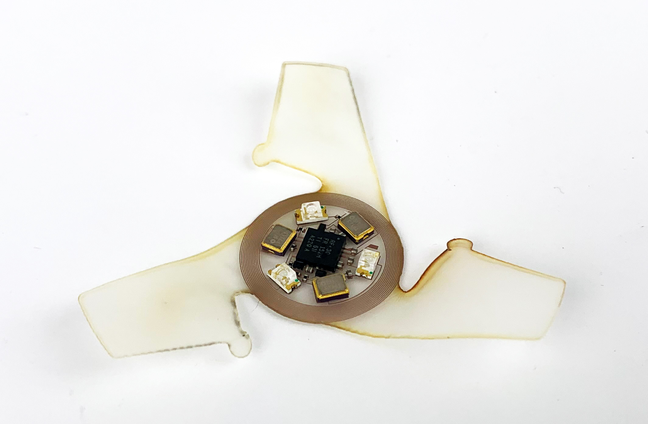 This is the top of a microflier with coil antenna and sensors to detect ultraviolet rays.