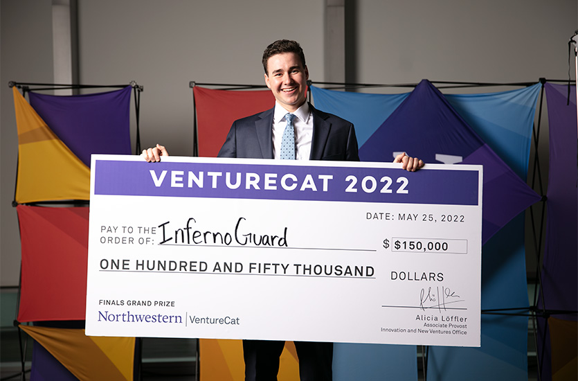 Kevin Kaspar holds the $150,000 check after InfernoGuard won the VentureCat grand prize.