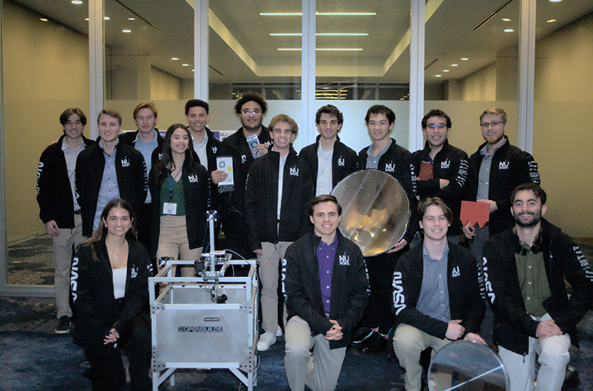 Members of the team pose with the Autonomous Casting RovEr.