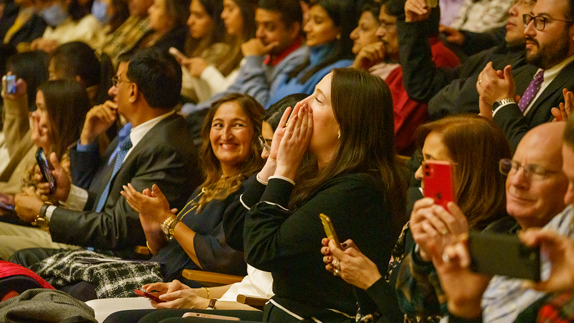 An audience member shouts encouragement during the ceremony.