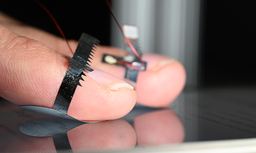 This image shows the devices worn on fingers and touching the glass-coated substrate.