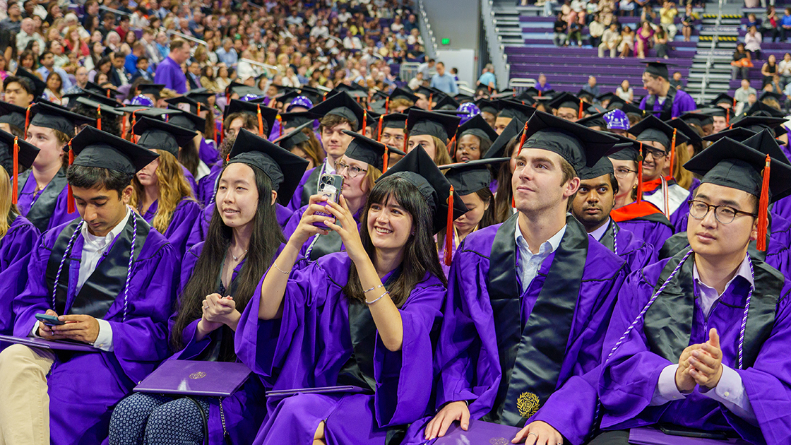 Graduates look on