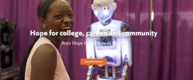 Image of girl laughing near a robotic display