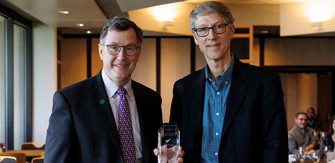 Andrew Armacost, left, poses with Professor Barry Nelson.