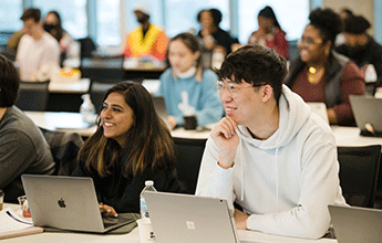 Students in class with laptops