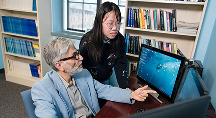 Professor speaking with student