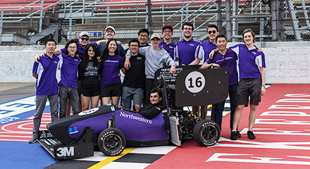 FSAE team with car