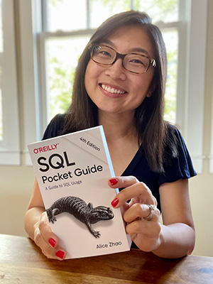 Alice Zhao with her book (O'Reilly's SQL Pocket Guide)