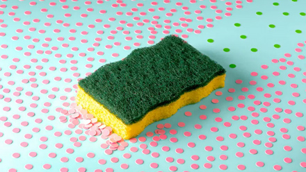 A sponge wiping up pink dots but leaving green dots in its wake