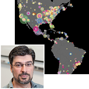 Luis Amaral and his map of BitTorrent activity during one week in March 2009. The size of each dot indicates the number of files shared by the corresponding user, and its color indicates the type of content typically shared by that user.