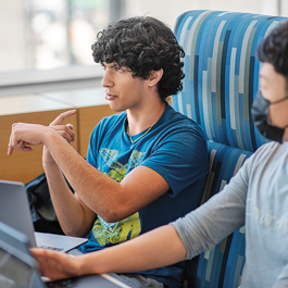 Computer Science student engaged in work with colleagues