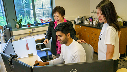 Faculty member collaborating with students