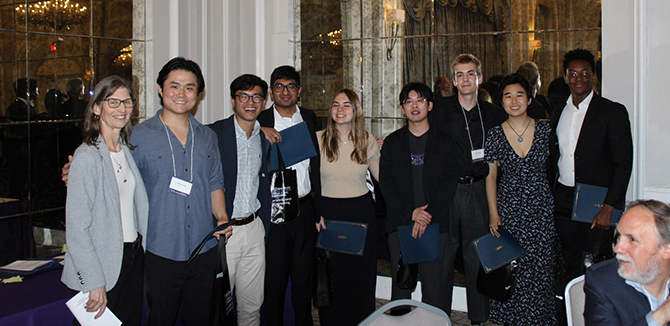 Professor Kathleen Stair poses with undergraduate awardees.