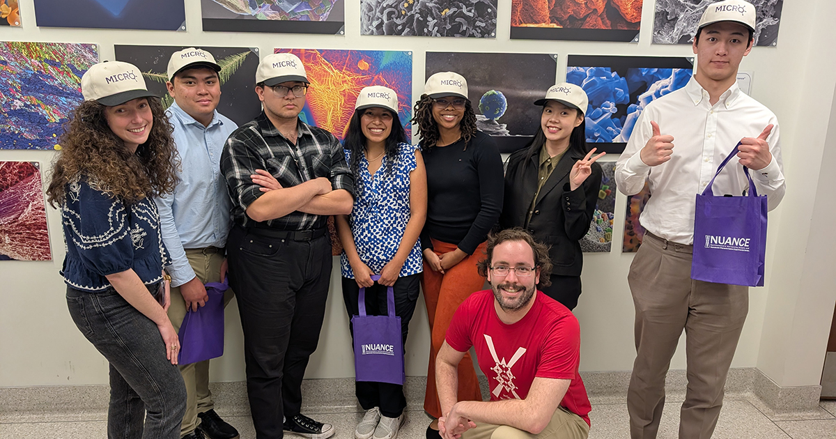 Professor Cécile Chazot, left, and MICRO participants pose for a photo.