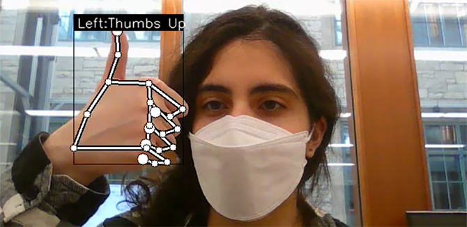 A computer identifying a thumbs-up through machine learning